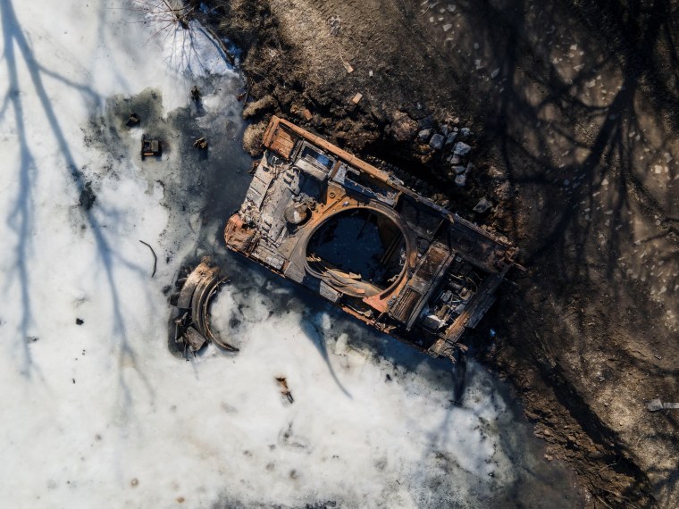 Image: A destroyed Russian tank is seen near the town of Trostianets