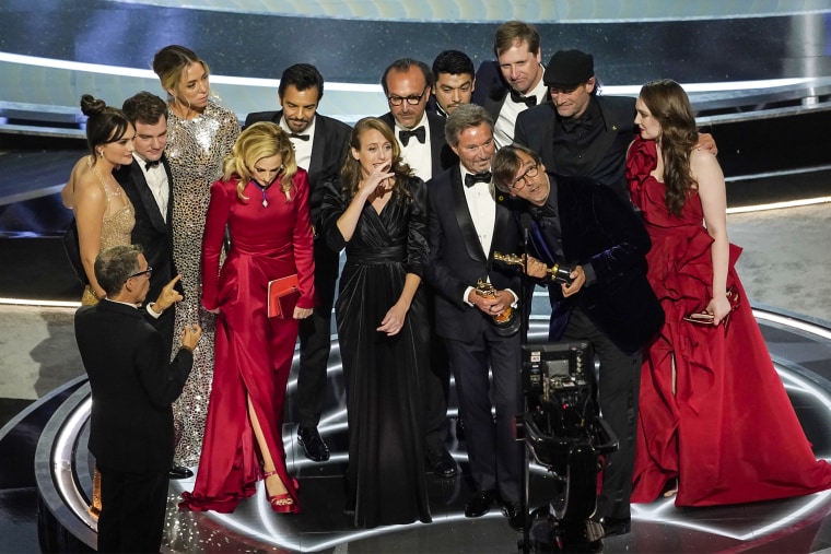 Image: The cast and crew of "CODA" accept the award for best picture at the Oscars on Sunday in Los Angeles.