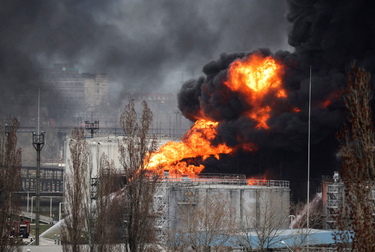 Firefighter work to extinguish a fire at an oil refinery following a missile attack near the port city of Odesa, Ukraine, on April 3, 2022.