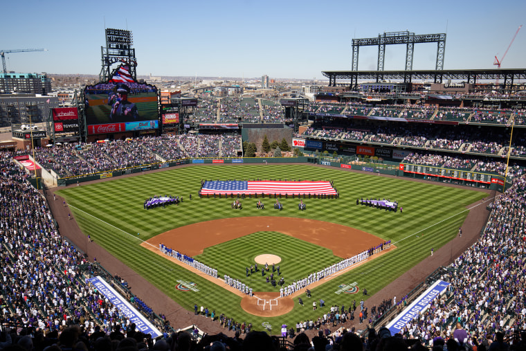 A general view of the stadium during National Anthem before a game between the Colorado Rockies and the Los Angeles Dodgers on Opening Day at Coors Field on April 8, 2022 in Denver, Colorado.