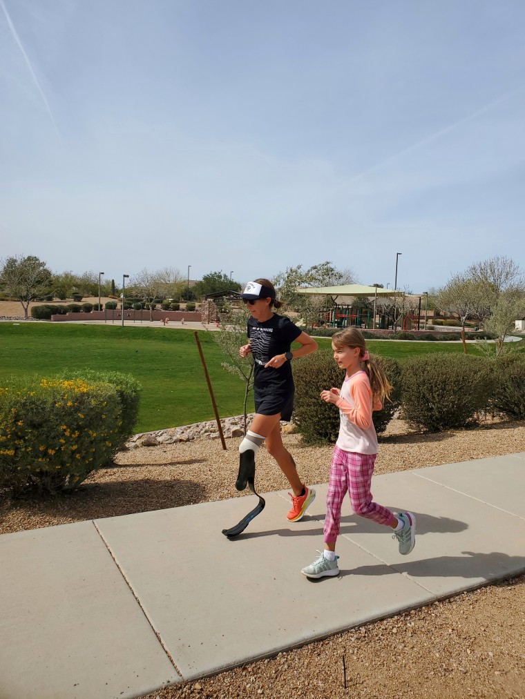 Jacky Hunt-Broersma running alongside her daughter.