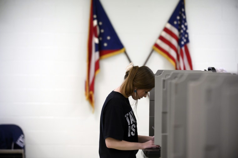 Image: A voter fills in her ballot during primary voting on May 3, 2022 in Lordstown, Ohio.
