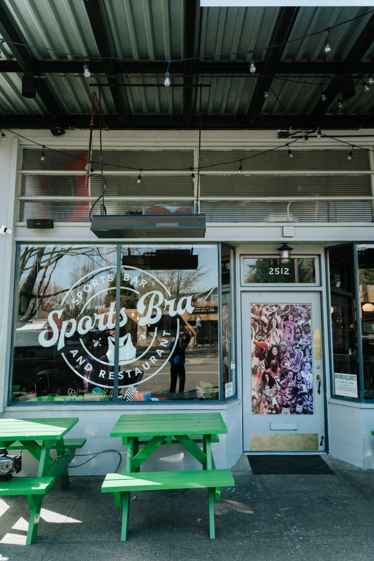 Men and women gather in a 40-seat area in Portland's Broadway Junction district to have a drink and interact with women in soccer, golf and trucks.