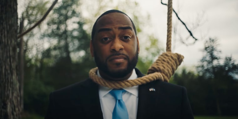 Image: Still from a campaign ad showing Charles Booker wearing a noose.