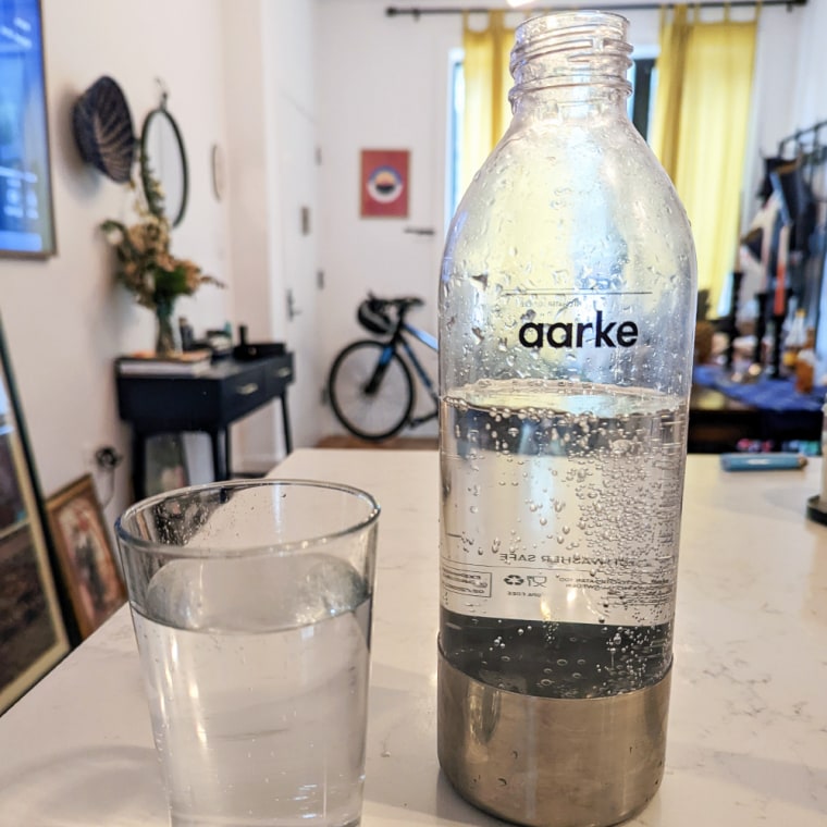 Image of a glass of water and aarke water