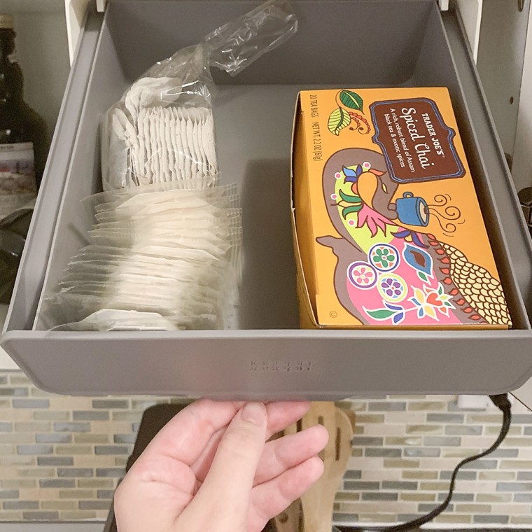 Image of a hand opening the CupboardStore Under-shelf drawer