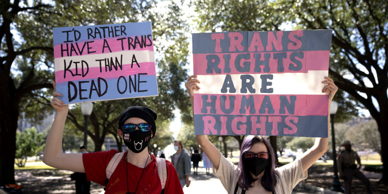 Texas transgender youth and their loved ones rally to decry Gov.Greg Abbott's directive to state health agencies to investigate gender-affirming care for kids as child abuse on Mar. 1, 2022.