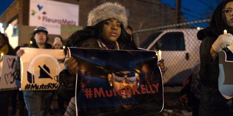 A demonstrator calling for a boycott of R.Kelly's music near his former recording studio in Chicago following the release of a Lifetime docuseries, "Surviving R. Kelly," which highlighted years of sexual abuse against young women on Jan. 9, 2019.