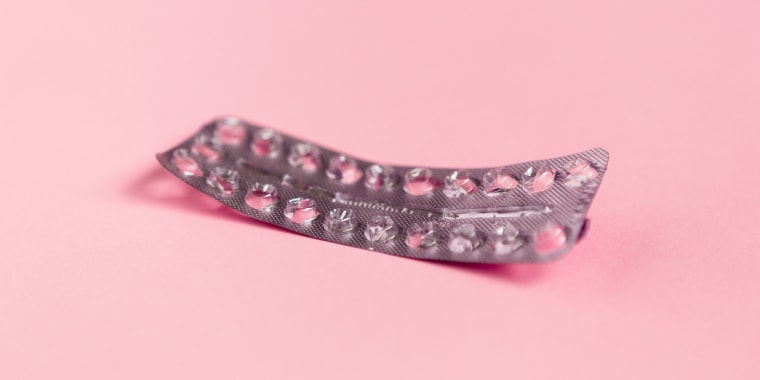 Image: Empty strip of birth control pills on a pink background.