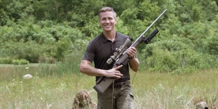 Image: Still from Eric Greitens' campaign ad where he's holding a rifle.