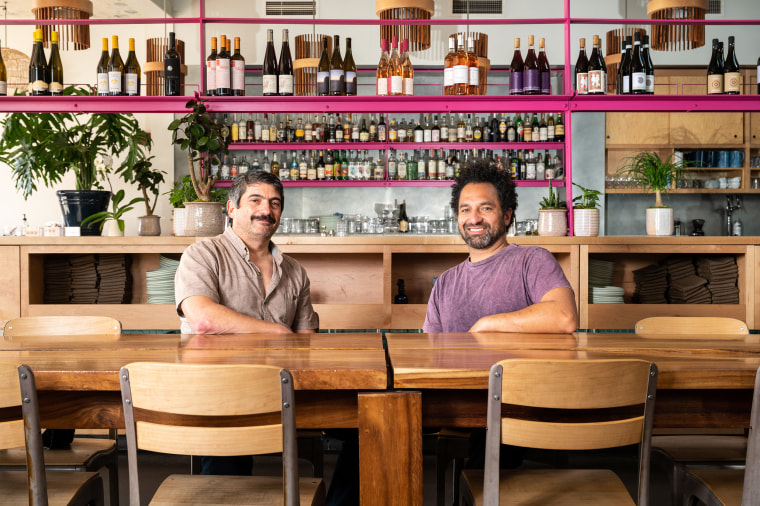 Seated at their restaurant Good Good Culture Club, in San Francisco, from left, co-owner Jeff Hanak and co-owner and chef Ravi Kapur.