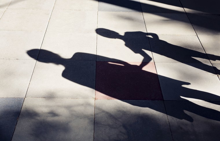 Image: Shadow of parent and child.