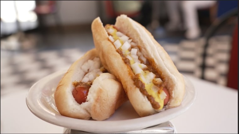A rabbit hot dog is a Detroit staple and is topped with a savory chili sauce, tangy mustard, and chopped onions.
