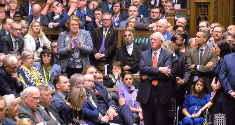 Pregnant Labour MP Tulip Siddiq, bottom right, sits in a wheelchair as Dr. Philippa Whitford MP raises a point of order after the Prime Minister lost a vote on her Brexit deal in the House of Commons in London on Jan. 15, 2019.