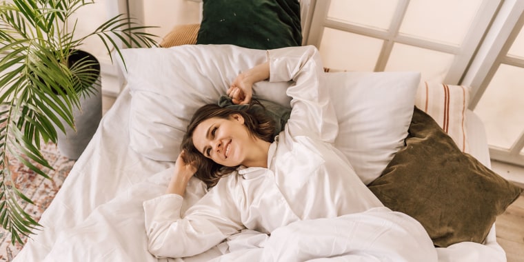 Young beautiful, woman waking up fully rested