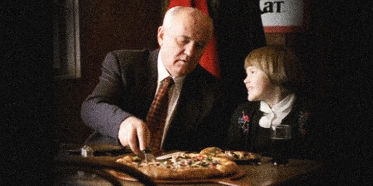 Image: Screengrab of Pizza Hut commercial showing Mikhail Gorbachev and child eating pizza.