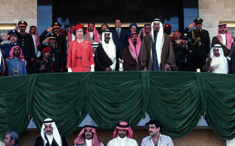 Queen Elizabeth ll watches camel racing with King Khalid and other members of the Saudi Royal Family on Feb. 18, 1979, in Riyadh.