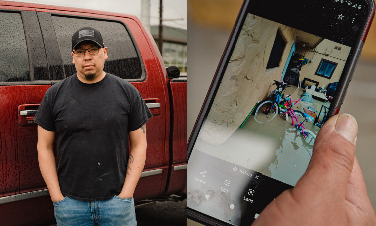 Reene Cabrera stands in front of the truck he used to evacuate his family after their home flooded