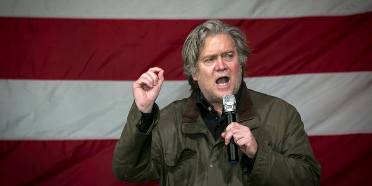 Image: Steve Bannon speaking against an American flag in the background.