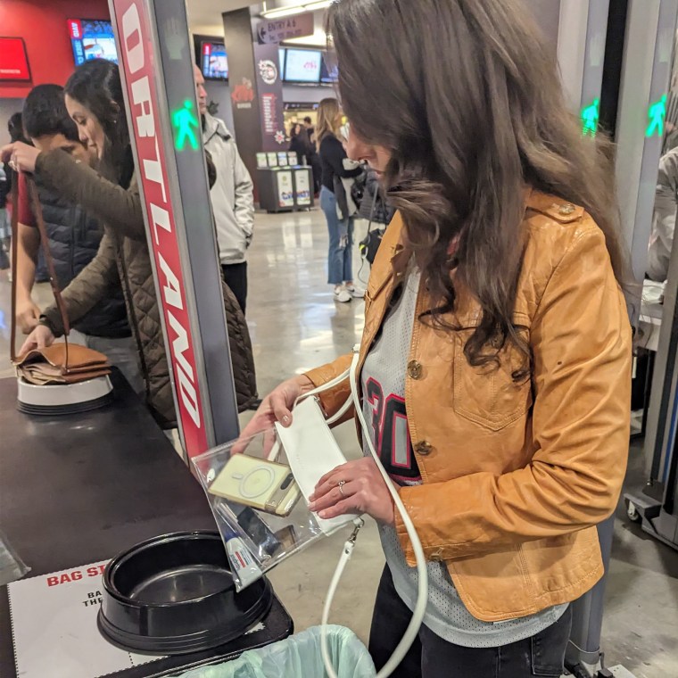 Woman going through security at an event with her clear bag