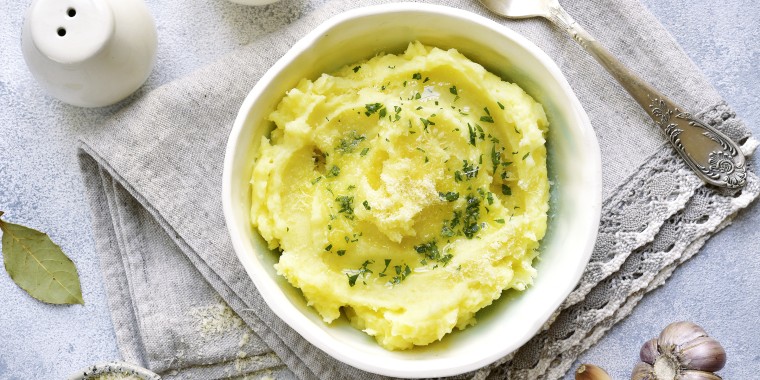 Potato mash with olive oil,parmesan cheese and greens
