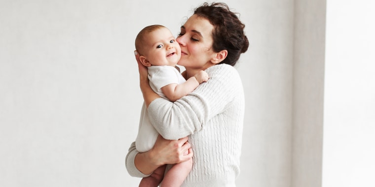 Woman with baby on white background