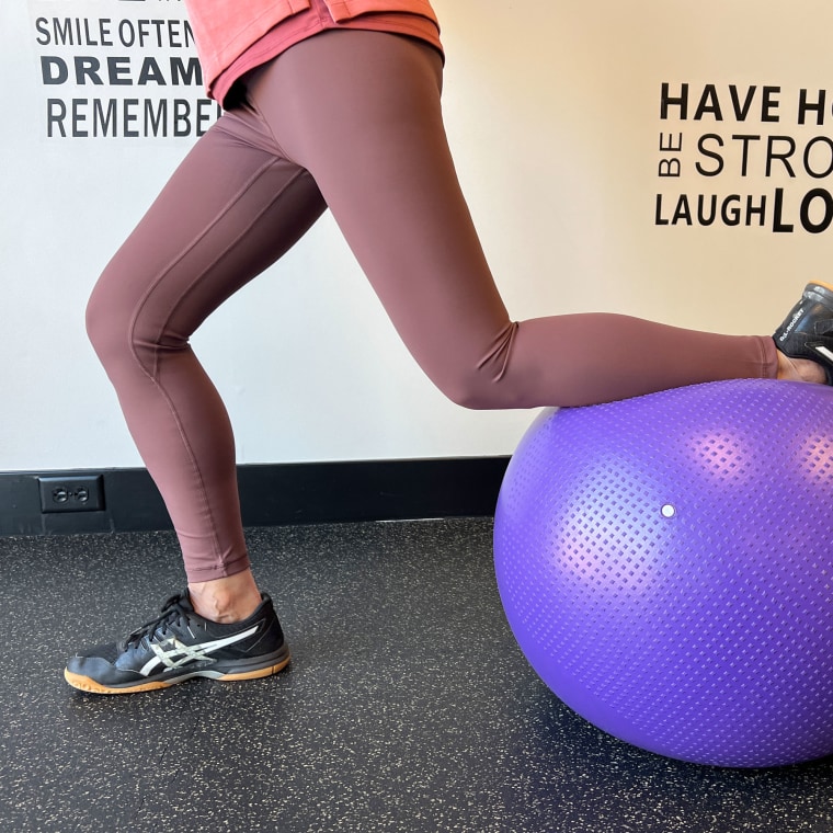 Woman wearing stylish pink leggings