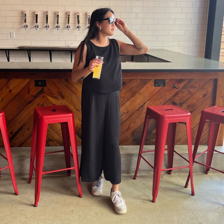 Woman wearing a black Amazon two-piece set while at a bar