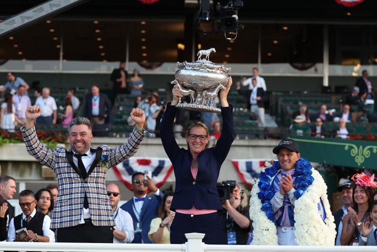 Trainer Jena Antonucci, the first woman trainer ever to win a Triple Crown race, holds the winners trophy with owner Jon Ebbert and Jockey Javier Castellano who rode riding Arcangelo to win the 155th running of the Belmont Stakes at Belmont Park on June 1