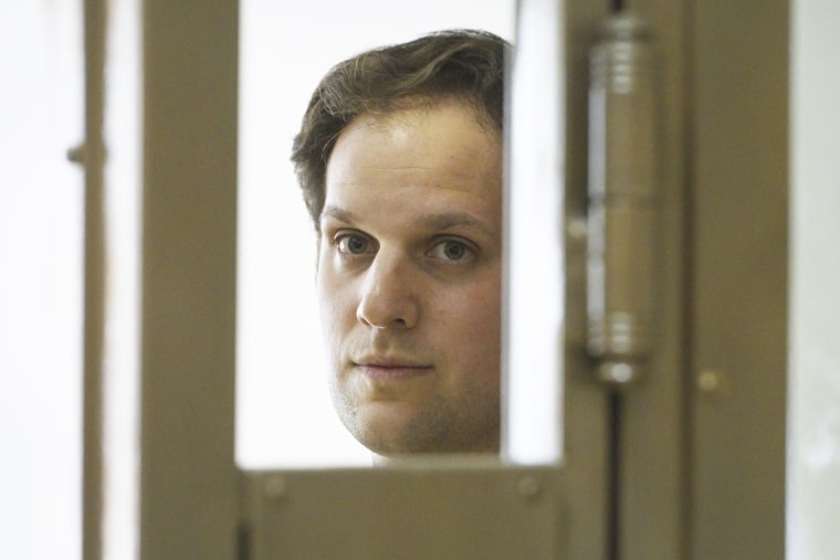 Wall Street Journal reporter Evan Gershkovich stands in a glass cage in a courtroom at the Moscow City Court in Moscow, Russia, Thursday, June 22, 2023. Gershkovich, a reporter detained on espionage charges in Russia, appeared in court Thursday to appeal