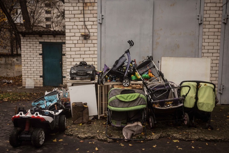 Strollers and toys are stacked outside a storage room at the Kherson Regional Children's Home in November 2022.