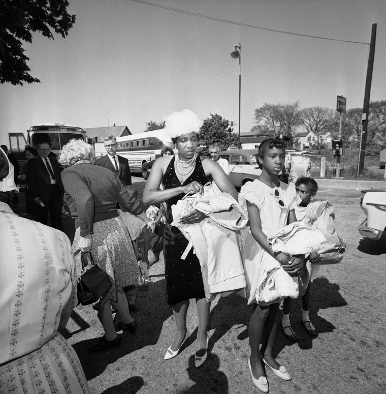 Lela Mae Williams, 36, of Huttig, Ark., with her two daughters Shirley, 12, and Joyce, 9, arrive at Hyannis, Mass., May 23, 1962 along with seven sons.