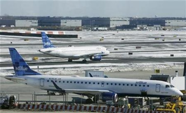 A JetBlue aircraft makes its way from the terminal at JFK International Airport in New York in February.