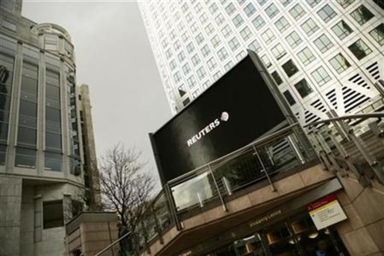 A television screen is shown outside the Reuters offices in London. The Independent on Sunday reported that the Reuters Founders Share Company is set to back a proposed takeover of the media group by Canada's Thomson Corp.