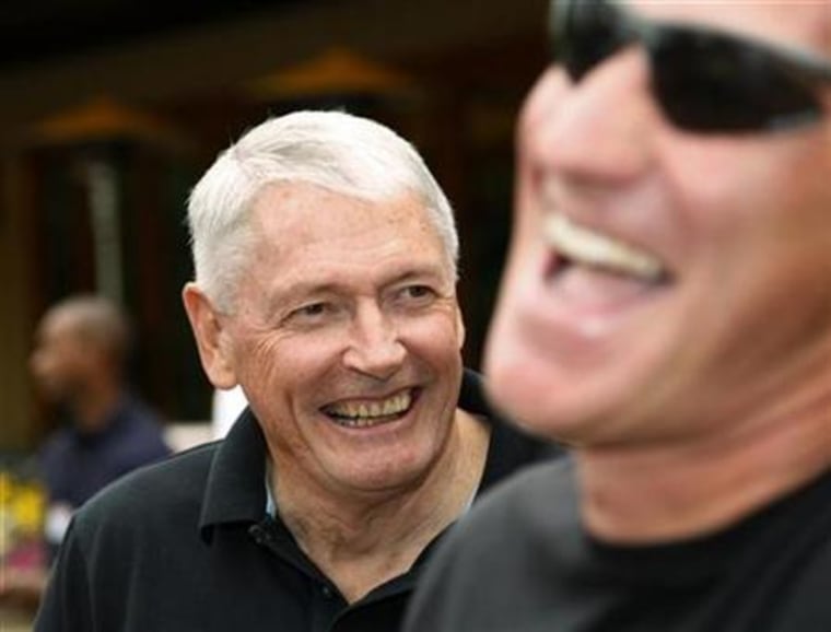Chairman of Liberty Media Corp. John Malone, left, at Sun Valley Resort in Idaho July 12, 2007. Malone is considering entering an $23 billion auction for cable operator Virgin Media, the Financial Times reported on its Web site on Sunday. 