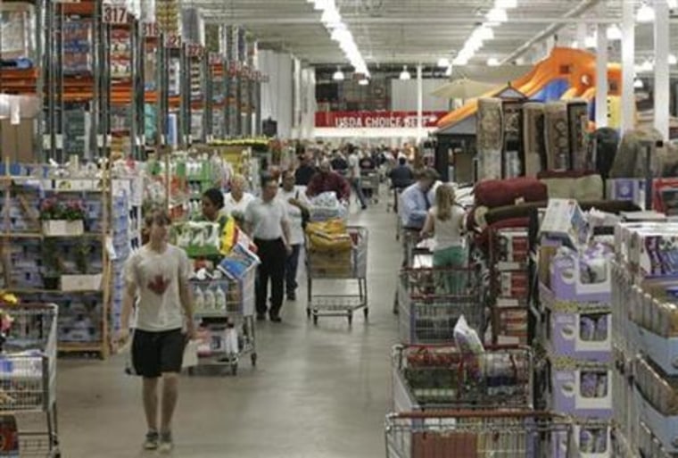 Shoppers work their way through a  Costco warehouse store in Arlington, Va.