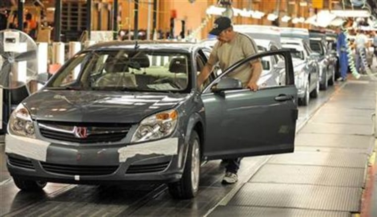 Harrison prepares to drive a Saturn Aura from the assembly line to its final inspection at the General Motors Fairfax Assembly Plant in Kansas City