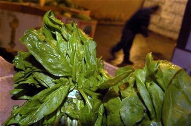 Bundled spinach is pictured in a cooler at a wholesale farmer's market in Washington