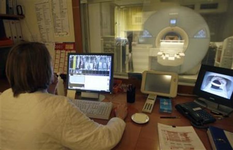 A radiologist studies an image from a magnetic resonance imaging scanner at the Ambroise Pare hospital in Marseille