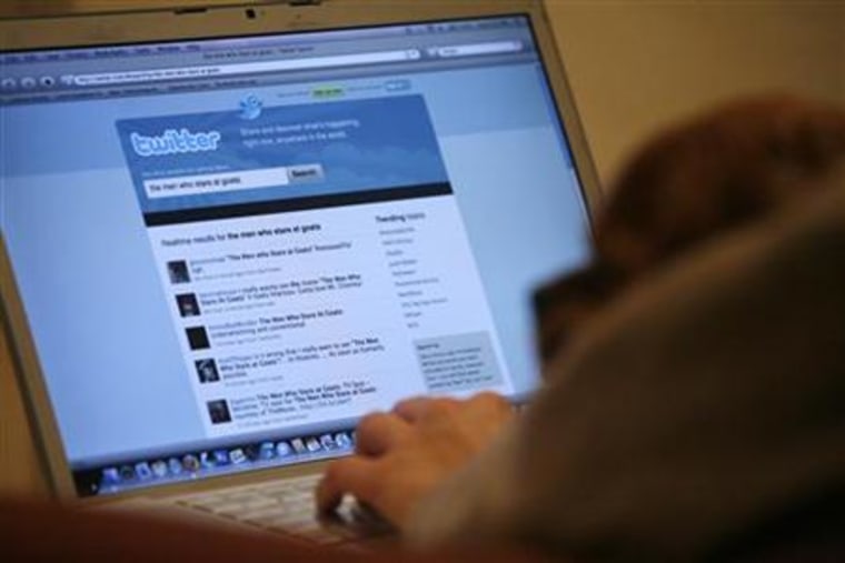 A Twitter page is displayed on a laptop computer in Los Angeles