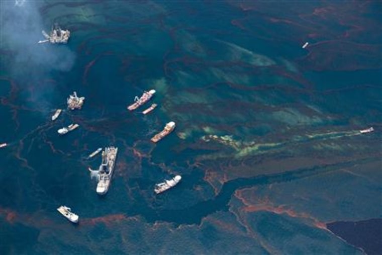 Ships work around a barge funnelling some of the leaking oil from the Deepwater Horizon wellhead in this aerial view over the Gulf