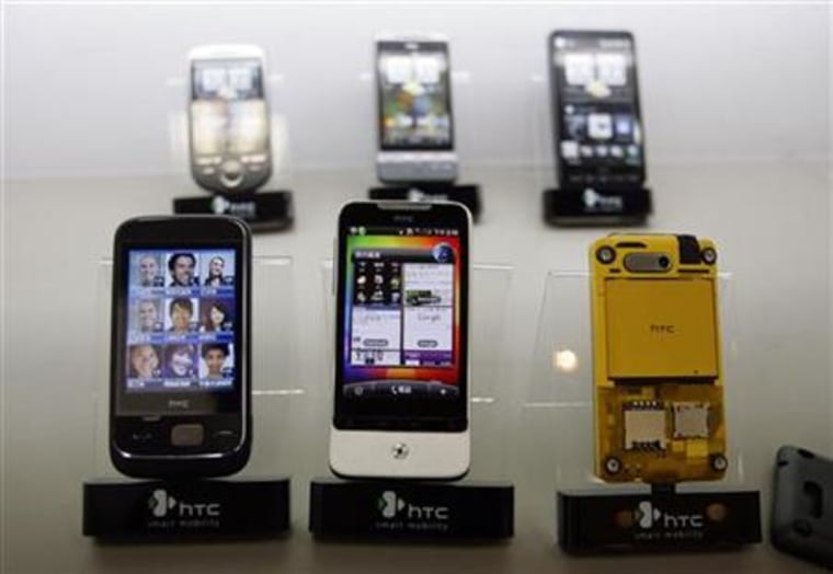 Smartphones are displayed in a mobile phone store in Taipei