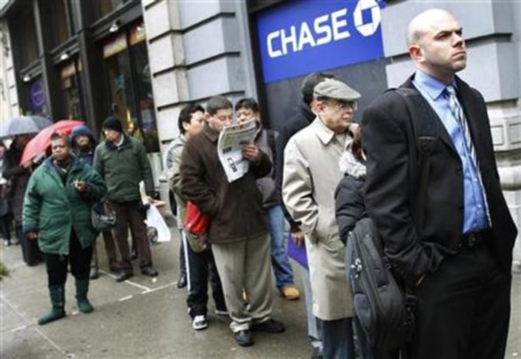 People wait in line to enter the NYCHires Job Fair in New York