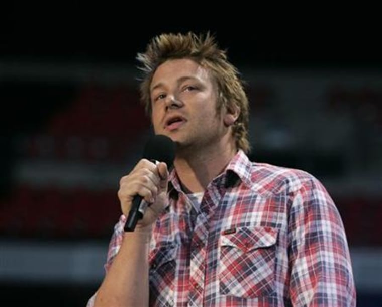 Jamie Oliver introduces P Diddy at the Concert for Diana at Wembley Stadium in London