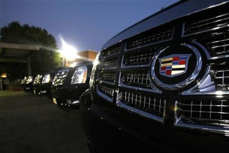 Vehicles for sale are parked at a Cadillac dealer in Sherman Oaks