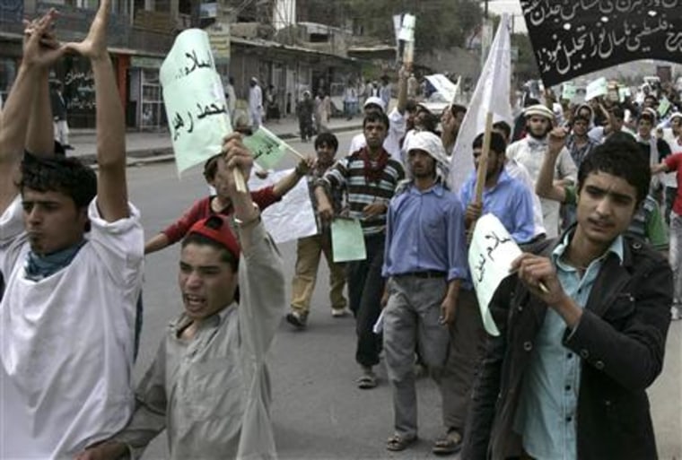 Afghan protesters shout slogans during a protest in Kabul