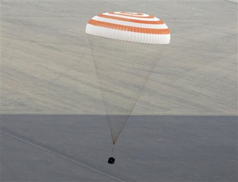 The Soyuz TMA-18 spacecraft is seen as it lands near the town of Arkalyk, northern Kazakhstan