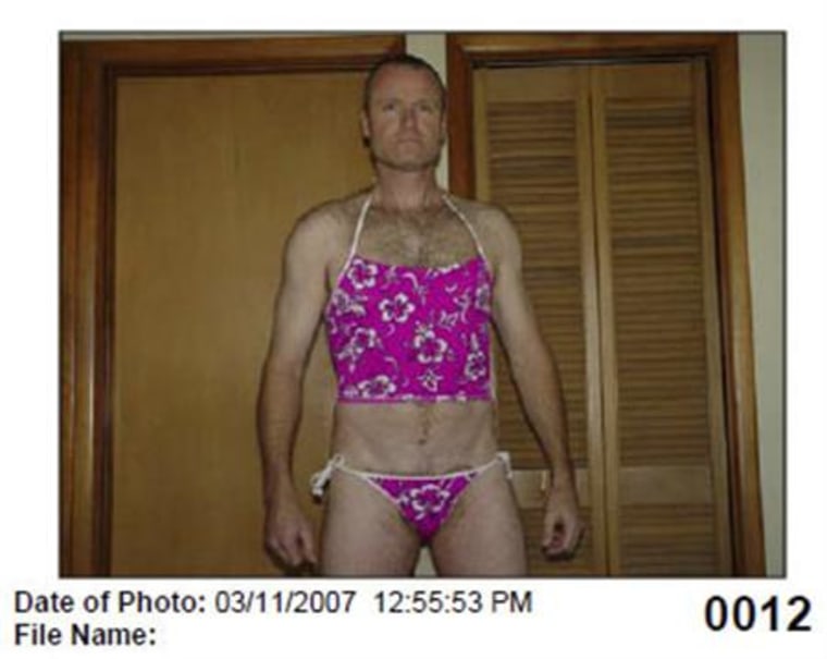 Canadian Colonel Russell Williams, seen in this evidence photo released by the court, poses in lingerie taken during a break-in committed in 2007
