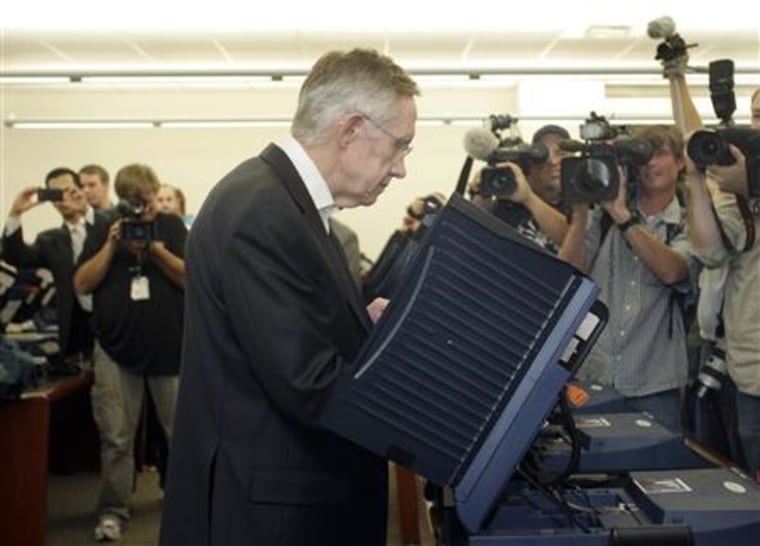 Senate Majority Leader Reid votes at an early voting polling place after an early voting rally at the University of Nevada Las Vegas, in Las Vegas