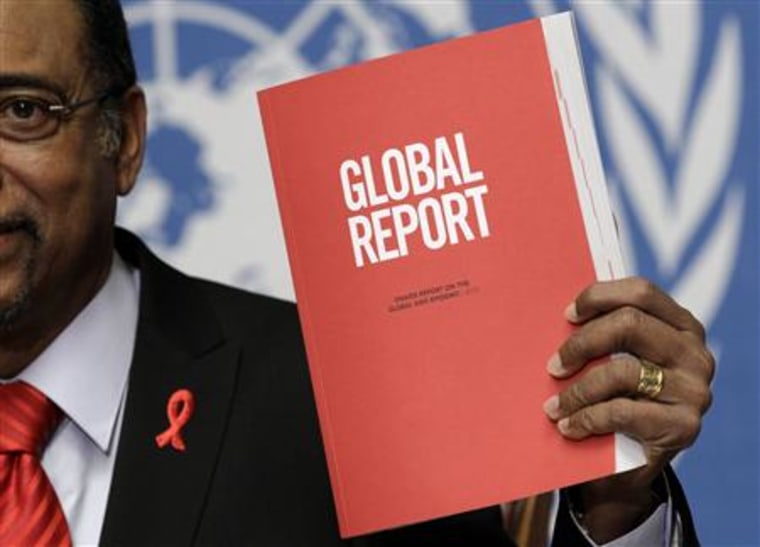 Sidibe Executive Director of UNAIDS holds a copy of the report during the launch of the UNAIDS 2010 Report on the global AIDS epidemic at the United Nations in Geneva
